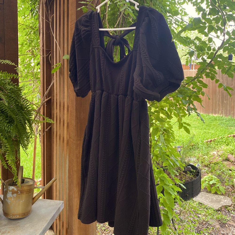 Short black dress. Heavy woven patterned fabric. Cute for work or date!